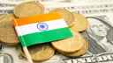 Indian flag resting on a pile of Euro coins with a US one dollar bill in the background