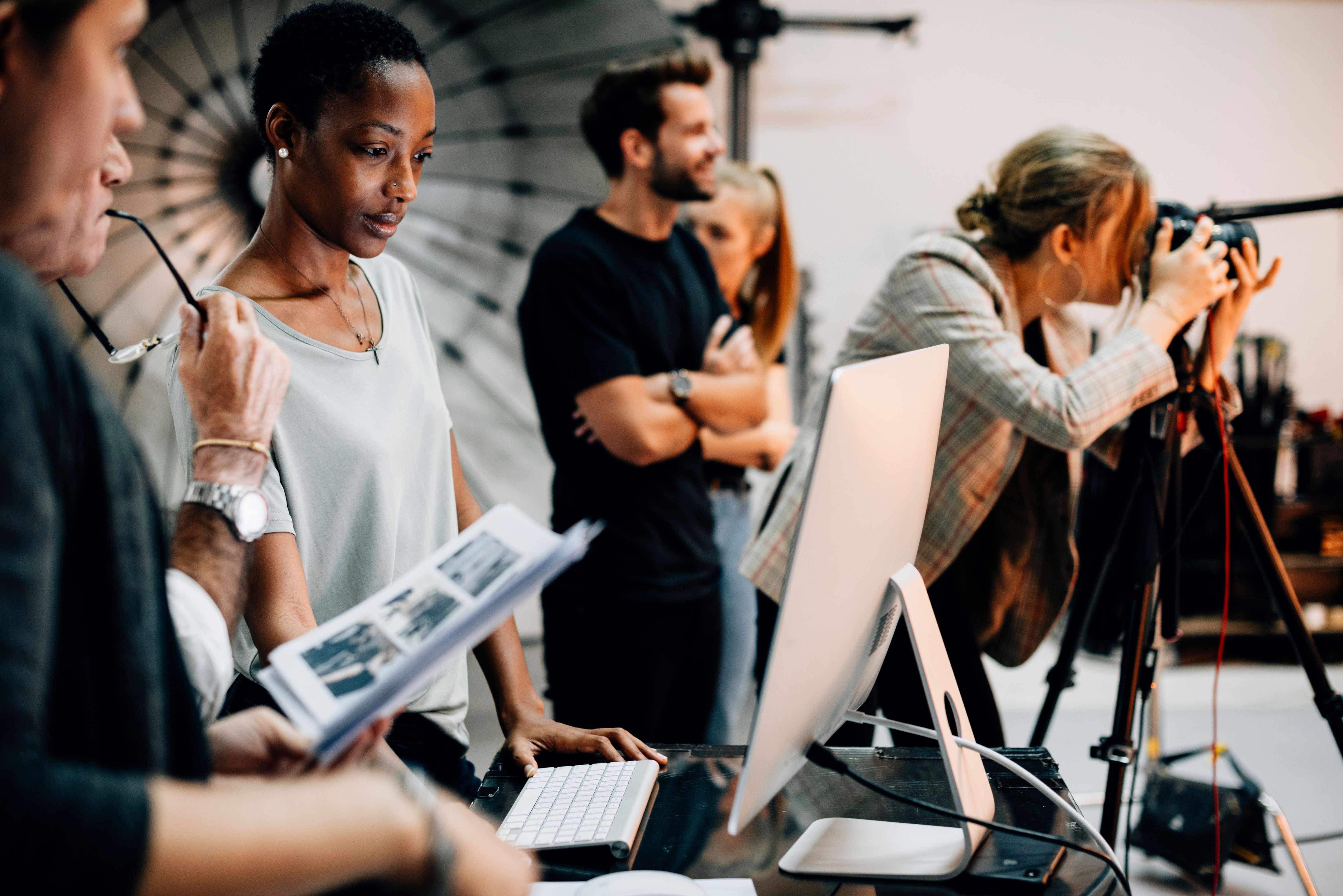 Creative Industry workers with laptop and camera