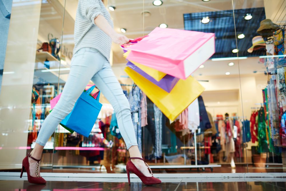 Woman walking with shopping bags