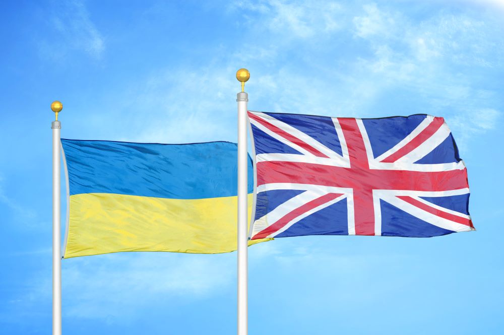 UK and Ukranian flags flying in breeze