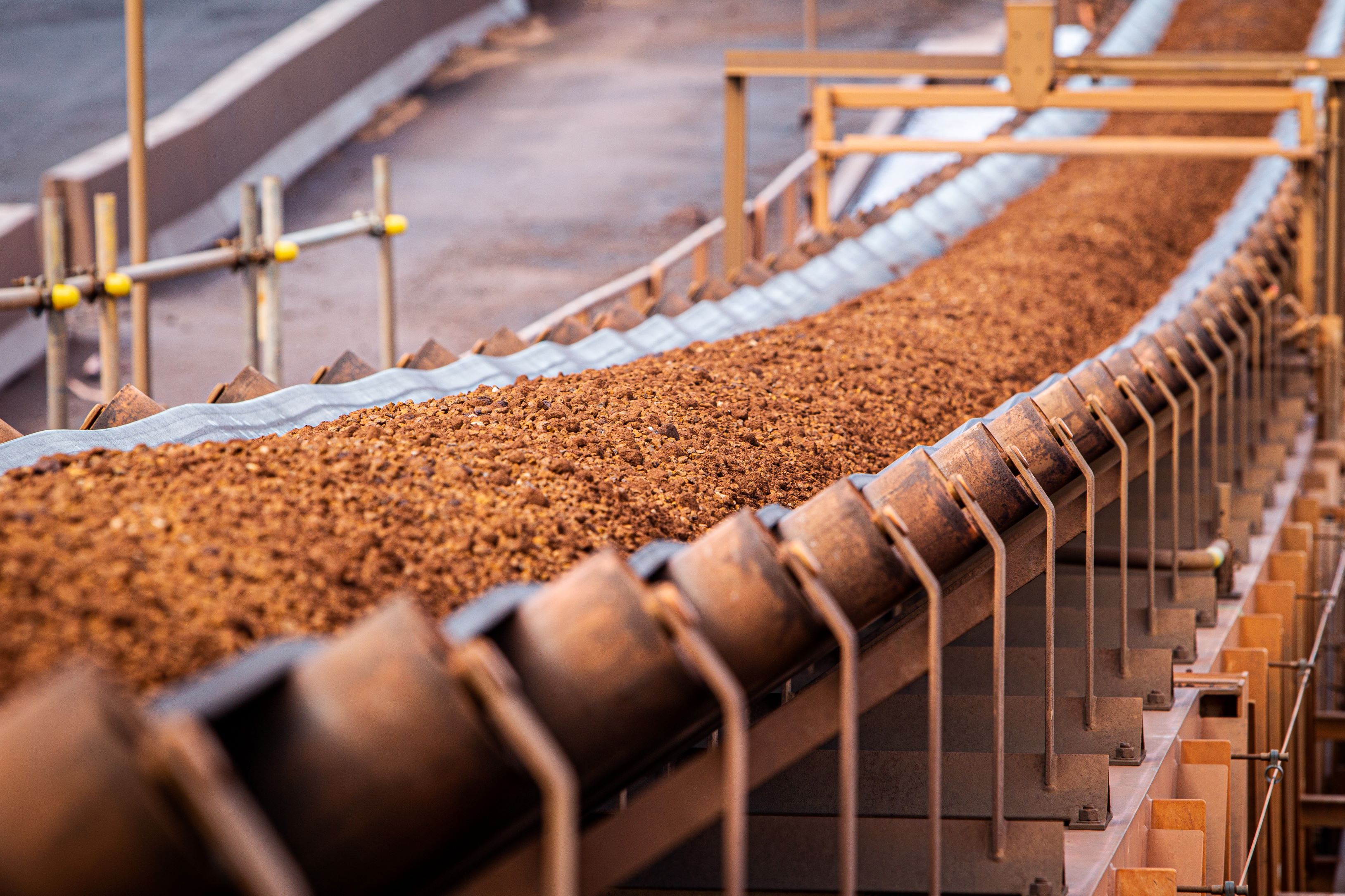 Iron ore being shipped along conveyer belt