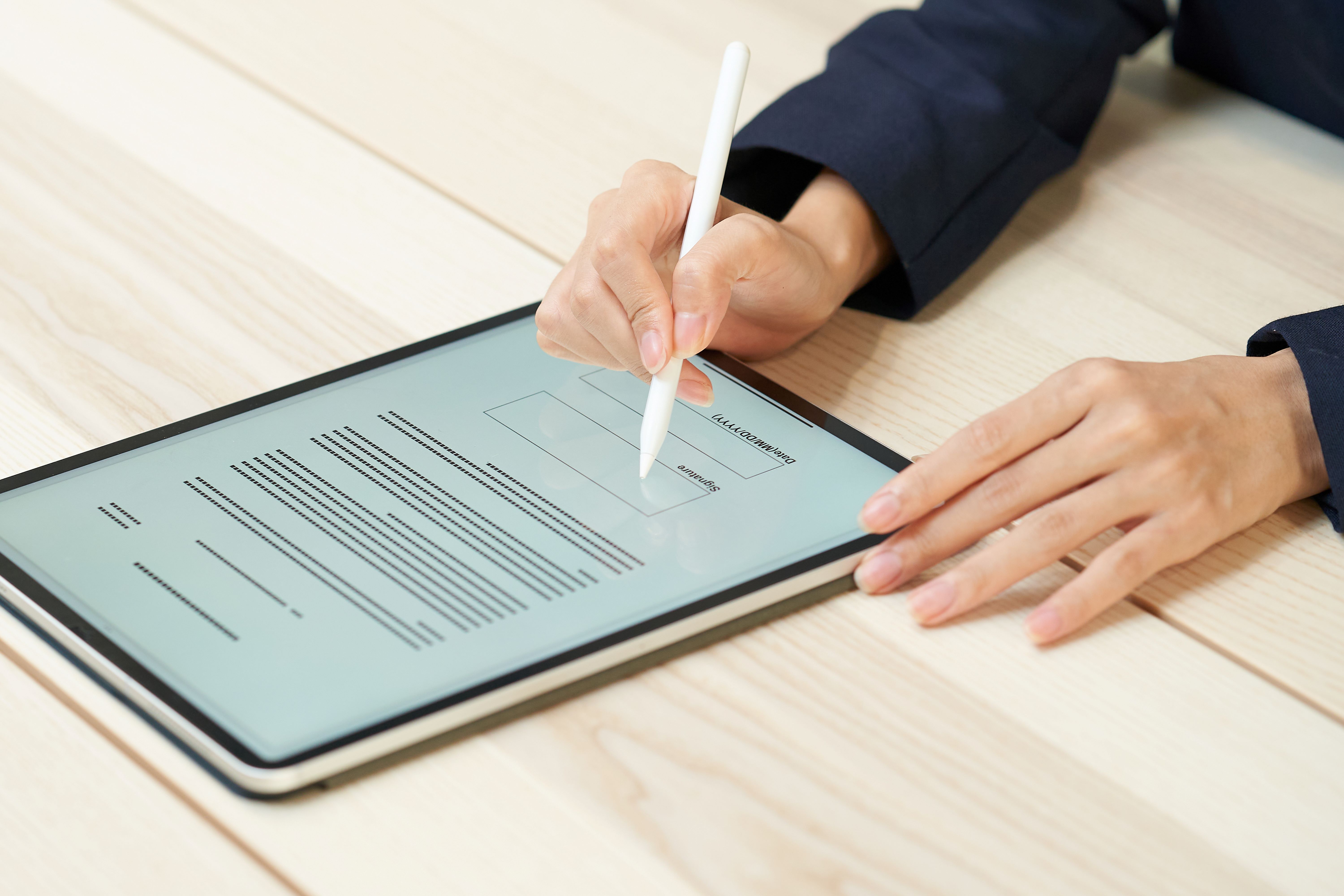 Electronic trade documents being used by person on tablet