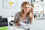 Woman with headphones at computer